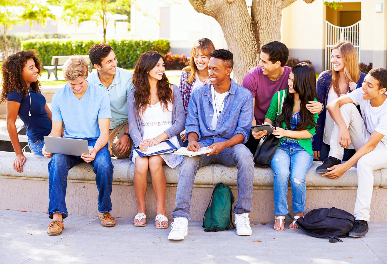 a group of american students looking each other